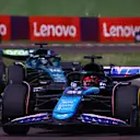 IMOLA, ITALY - MAY 19: Esteban Ocon of France driving the (31) Alpine F1 A524 Renault leads Lance Stroll of Canada driving the (18) Aston Martin AMR24 Mercedes during the F1 Grand Prix of Emilia-Romagna at Autodromo Enzo e Dino Ferrari Circuit on May 19, 2024 in Imola, Italy. (Photo by Bryn Lennon - Formula 1/Formula 1 via Getty Images)
