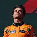 BUDAPEST, HUNGARY - JULY 21: Second placed Lando Norris of Great Britain and McLaren stands on the podium during the F1 Grand Prix of Hungary at Hungaroring on July 21, 2024 in Budapest, Hungary. (Photo by Dean Mouhtaropoulos/Getty Images)