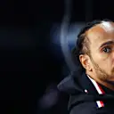 SUZUKA, JAPAN - APRIL 05: Lewis Hamilton of Great Britain and Mercedes looks on in the garage during practice ahead of the F1 Grand Prix of Japan at Suzuka International Racing Course on April 05, 2024 in Suzuka, Japan. (Photo by Bryn Lennon - Formula 1/Formula 1 via Getty Images)
