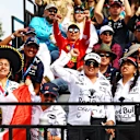 Fans fill the grandstands in sombreros and waving flags, turning the circuit into a sea of colour and national pride