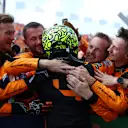 ZANDVOORT, NETHERLANDS - AUGUST 25: Race winner Lando Norris of Great Britain and McLaren celebrates with Team McLaren in parc ferme after the F1 Grand Prix of Netherlands at Circuit Zandvoort on August 25, 2024 in Zandvoort, Netherlands. (Photo by Bryn Lennon - Formula 1/Formula 1 via Getty Images)