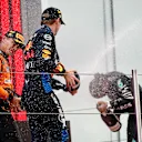 BARCELONA, SPAIN - JUNE 23: Race winner Max Verstappen of the Netherlands and Oracle Red Bull Racing, Second placed Lando Norris of Great Britain and McLaren, and Third placed Lewis Hamilton of Great Britain and Mercedes celebrate on the podium during the F1 Grand Prix of Spain at Circuit de Barcelona-Catalunya on June 23, 2024 in Barcelona, Spain. (Photo by Chris Graythen/Getty Images)