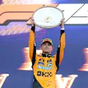 MELBOURNE, AUSTRALIA - MARCH 16: Race winner Lando Norris of Great Britain and McLaren lifts his trophy on the podium during the F1 Grand Prix of Australia at Albert Park Grand Prix Circuit on March 16, 2025 in Melbourne, Australia. (Photo by Mark Thompson/Getty Images)