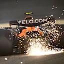 BAHRAIN, BAHRAIN - APRIL 11: Sparks fly behind Lando Norris of Great Britain driving the (4) McLaren MCL39 Mercedes on track during practice ahead of the F1 Grand Prix of Bahrain at Bahrain International Circuit on April 11, 2025 in Bahrain, Bahrain. (Photo by Clive Mason/Getty Images)