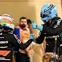 BAHRAIN, BAHRAIN - APRIL 12: Second placed qualifier George Russell of Great Britain and Mercedes AMG Petronas F1 Team is congratulated by Fourth placed qualifier Andrea Kimi Antonelli of Italy and Mercedes AMG Petronas F1 Team in parc ferme during qualifying ahead of the F1 Grand Prix of Bahrain at Bahrain International Circuit on April 12, 2025 in Bahrain, Bahrain. (Photo by Mark Sutton - Formula 1/Formula 1 via Getty Images)