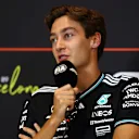 BARCELONA, SPAIN - MAY 29: George Russell of Great Britain and Mercedes AMG Petronas F1 Team speaks in the Drivers Press Conference during previews ahead of the F1 Grand Prix of Spain at Circuit de Barcelona-Catalunya on May 29, 2025 in Barcelona, Spain. (Photo by Clive Rose/Getty Images)