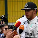 Lewis Hamilton (GBR) Mercedes AMG F1 is interviewed by the media. Formula One World Championship, Rd18, Brazilian Grand Prix, Qualifying, Sao Paulo, Brazil, Saturday, 8 November 2014 