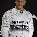 Lewis Hamilton (GBR) Mercedes AMG F1 celebrates on the podium. Formula One World Championship, Rd19, Abu Dhabi Grand Prix, Race, Yas Marina Circuit, Abu Dhabi, UAE, Sunday, 23 November 2014