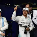 Lewis Hamilton (GBR) Mercedes AMG F1 celebrates his second place in qualifying in parc ferme. Valtteri Bottas (FIN) Williams Martini Racing, left, was third. Formula One World Championship, Rd19, Abu Dhabi Grand Prix, Qualifying, Yas Marina Circuit, Abu Dhabi, UAE, Saturday, 22 November 2014 