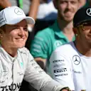 Nico Rosberg (GER) Mercedes AMG F1 celebrates with Lewis Hamilton (GBR) Mercedes AMG F1 and the team. Formula One World Championship, Rd18, Brazilian Grand Prix, Qualifying, Sao Paulo, Brazil, Sunday, 9 November 2014 