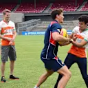 Nico Hulkenberg (GER) Force India F1 and Sergio Perez (MEX) Force India F1 with AFL Premiership Western Bulldogs at Whitten Oval. Formula One World Championship, Rd1, Australian Grand Prix, Preparations, Albert Park, Melbourne, Australia, Tuesday, 11 March 2014
