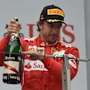 Third placed Fernando Alonso (ESP) Ferrari celebrates on the podium with the champagne. Formula One World Championship, Rd4, Chinese Grand Prix, Race, Shanghai, China, Sunday, 20 April 2014