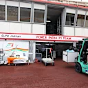 Freight is loaded into the Force India garage