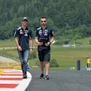 Daniel Ricciardo (AUS) Red Bull Racing walks the track with Simon Rennie (GBR) Red Bull Racing Race Engineer. Formula One World Championship, Rd8, Austrian Grand Prix, Preparations, Spielberg, Austria, Thursday, 19 June 2014