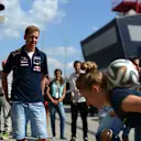 Daniel Ricciardo (AUS) Red Bull Racing and Sebastian Vettel (GER) Red Bull Racing watch soccer skills. Formula One World Championship, Rd11, Hungarian Grand Prix, Preparations, Hungaroring, Hungary. Thursday, 24 July 2014 © Sutton Images. No reproduction without permission