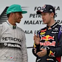 Race winner Lewis Hamilton (GBR) Mercedes AMG F1 and Sebastian Vettel (GER) Red Bull Racing on the podium. Formula One World Championship, Rd2, Malaysian Grand Prix, Race, Sepang, Malaysia, Sunday, 30 March 2014 © Sutton Images. No reproduction without permission