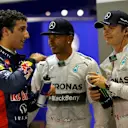 (L to R): Daniel Ricciardo (AUS) Red Bull Racing, pole sitter Lewis Hamilton (GBR) Mercedes AMG F1 and Nico Rosberg (GER) Mercedes AMG F1 celebrate in parc ferme. Formula One World Championship, Rd14, Singapore Grand Prix, Marina Bay Street Circuit, Singapore, Qualifying, Saturday, 20 September 2014 © Sutton Images. No reproduction without permission