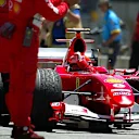 Race winner Michael Schumacher (GER) Ferrari F2004 salutes the Ferrari mechanics in parc ferme. Formula One World Championship, Rd9, United States Grand Prix, Race Day, Indianapolis, USA, 20 June 2004. © Sutton Images