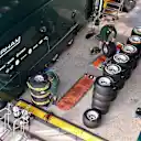 Caterham mechanics and Pirelli tyres. Formula One Testing Preparations, Jerez, Spain, Monday, 27 January 2014. © Sutton Images