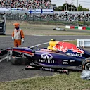 The crashed car of Daniel Ricciardo (AUS) Red Bull Racing RB10 is recovered in FP2. Formula One World Championship, Rd15, Japanese Grand Prix, Practice, Suzuka, Japan, Friday, 3 October 2014