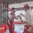 Fernando Alonso keeps energy levels high at Ferrari, sharing a bunch of grapes with his mechanics and engineers during FP1 © FOWC Ltd
