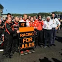 Max Chilton (GBR) Marussia F1 Team; Dave Greenwood (GBR) Marussia Chief Engineer; Graeme Lowdon (GBR) Marussia F1 President; Sporting Director and Charlie Whiting (GBR) FIA Delegate and Matteo Bonciani (ITA) FIA Media Delegate, remember the injured Jules Bianchi (FRA) Marussia F1 Team. Formula One World Championship, Rd16, Russian Grand Prix, Race, Sochi Autodrom, Sochi, Krasnodar Krai, Russia, Sunday, 12 October 2014