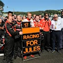 Max Chilton (GBR) Marussia F1 Team; Dave Greenwood (GBR) Marussia Chief Engineer; Graeme Lowdon (GBR) Marussia F1 President; Sporting Director and Charlie Whiting (GBR) FIA Delegate and Matteo Bonciani (ITA) FIA Media Delegate, remember the injured Jules Bianchi (FRA) Marussia F1 Team. Formula One World Championship, Rd16, Russian Grand Prix, Race, Sochi Autodrom, Sochi, Krasnodar Krai, Russia, Sunday, 12 October 2014