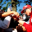 Kimi Raikkonen (FIN) Ferrari arrives at the track and signs autographs for the fans. Formula One World Championship, Rd13, Italian Grand Prix, Monza, Italy, Qualifying, Saturday, 6 September 2014