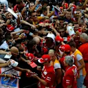 Kimi Raikkonen (FIN) Ferrari and Fernando Alonso (ESP) Ferrari sign autographs for the fans. Formula One World Championship, Rd13, Italian Grand Prix, Monza, Italy, Preparations, Thursday, 4 September 2014 © Sutton Images. No reproduction without permission