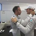 Gracious in defeat, Nico Rosberg congratulates his Mercedes team mate and season-long title rival Lewis Hamilton on becoming the 2014 Formula One world champion © FOWC Ltd. No reproduction without permission.