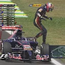 Jean-Eric Vergne jumps clear of his Toro Rosso after pulling to a halt at the side of the circuit, temporarily bringing out the red flags in FP2 © FOWC Ltd. No reproduction without permission.