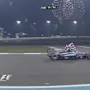 Flying the flag for Great Britain, Abu Dhabi racewinner and 2014 Formula One world champion Lewis Hamilton celebrates in the cockpit of his Mercedes © FOWC Ltd. No reproduction without permission.