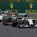Nico Rosberg (GER) Mercedes AMG F1 W05 leads Sebastian Vettel (GER) Red Bull Racing RB10 and Lewis Hamilton (GBR) Mercedes AMG F1 W05. Formula One World Championship, Rd11, Hungarian Grand Prix, Race Day, Hungaroring, Hungary. Sunday, 27 July 2014. © Sutton Images