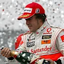 Fernando Alonso (ESP) McLaren Mercedes celebrates on the podium Formula One World Championship, Rd17, Brazilian Grand Prix, Race Day, Interlagos, Sao Paulo, Brazil, Sunday, 21 October 2007. © Sutton Images