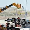 The car of Pastor Maldonado (VEN) Lotus E22 is recovered. Formula One Testing, Day Three, Bahrain International Circuit, Sakhir, Bahrain, Friday, 21 February 2014 © Sutton Images. No reproduction without permission