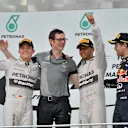 (L to R): Nico Rosberg (GER) Mercedes AMG F1, Andy Shovlin (GBR) Mercedes AMG F1 Chief Engineer, race winner Lewis Hamilton (GBR) Mercedes AMG F1 and Sebastian Vettel (GER) Red Bull Racing celebrate on the podium. Formula One World Championship, Rd2, Malaysian Grand Prix, Race, Sepang, Malaysia, Sunday, 30 March 2014. © Sutton Images