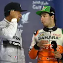 Lewis Hamilton (GBR) Mercedes AMG F1 and Sergio Perez (MEX) Force India on the podium. Formula One World Championship, Rd3, Bahrain Grand Prix, Race, Bahrain International Circuit, Sakhir, Bahrain, Sunday, 6 April 2014. © Sutton Images