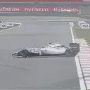 Williams' Valtteri Bottas spins exiting Turn 10 as the fine rain continues. © FOWC Ltd.
