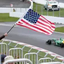 A fan waves the Stars and Stripes for Alexander Rossi (USA) Caterham third driver. Formula One World Championship, Rd7, Canadian Grand Prix, Practice, Montreal, Canada, Friday, 7 June 2013. © Sutton Images