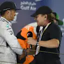 Race winner Lewis Hamilton (GBR) Mercedes AMG F1 with Brian Johnson (GBR) AC/DC lead singer on the podium. Formula One World Championship, Rd3, Bahrain Grand Prix, Race, Bahrain International Circuit, Sakhir, Bahrain, Sunday, 6 April 2014. © Sutton Images