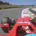 Fernando Alonso fights his Ferrari F14 T as he rumbles over the kerbs at Turn 8. © FOWC Ltd