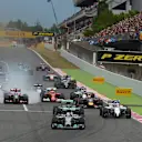Lewis Hamilton (GBR) Mercedes AMG F1 W05 leads at the start of the race as Romain Grosjean (FRA) Lotus E22 locks up his brakes. Formula One World Championship, Rd5, Spanish Grand Prix, Race, Barcelona, Spain, Sunday, 11 May 2014. © Sutton Images