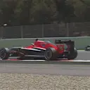 The 'monkey seat' rear wing flies off the back of Max Chilton's Marussia as he runs over the kerbs at Turn 16. © FOWC Ltd