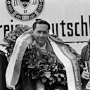 The podium (L to R): John Surtees (GBR) Cooper second; Jack Brabham (AUS) Brabham race winner; Jochen Rindt (AUT) Cooper third. German Grand Prix, Nurburgring, 7 August 1966. World © Phipps/Sutton. © Sutton Images