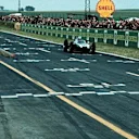 Jack Brabham (AUS) Cooper Climax T53 crosses the line to win the race. French Grand Prix, Reims, France, 3 July 1960. © Sutton Images