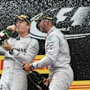 Race winner Lewis Hamilton (GBR) Mercedes AMG F1 celebrates on the podium with Nico Rosberg (GER) Mercedes AMG F1 and the champagne. Formula One World Championship, Rd5, Spanish Grand Prix, Race, Barcelona, Spain, Sunday, 11 May 2014. © Sutton Images