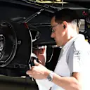 McLaren mechanic works on McLaren MP4-29 barke duct and wheel hub. Formula One World Championship, Rd5, Spanish Grand Prix, Practice, Barcelona, Spain, Friday, 9 May 2014. © Sutton Images