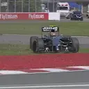 McLaren's Kevin Magnussen goes too deep and spins across the grass through Turns 1 and 2. © FOWC Ltd.