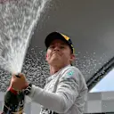 Race winner Nico Rosberg (GER) Mercedes AMG F1 celebrates with the champagne on the podium. Formula One World Championship, Rd8, Austrian Grand Prix, Race, Spielberg, Austria, Sunday, 22 June 2014