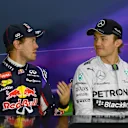 Sebastian Vettel (GER) Red Bull Racing and Nico Rosberg (GER) Mercedes AMG F1 in the Press Conference. Formula One World Championship, Rd9, British Grand Prix, Qualifying, Silverstone, England, Saturday, 5 July 2014